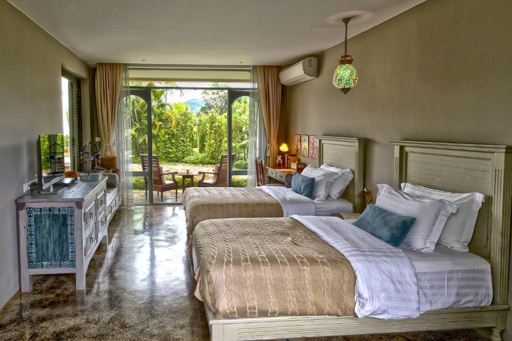 chambre double avec 2 lits et terrasse privée