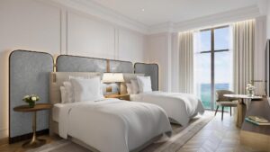 chambre à lits jumeaux avec balcon donnant sur la mer