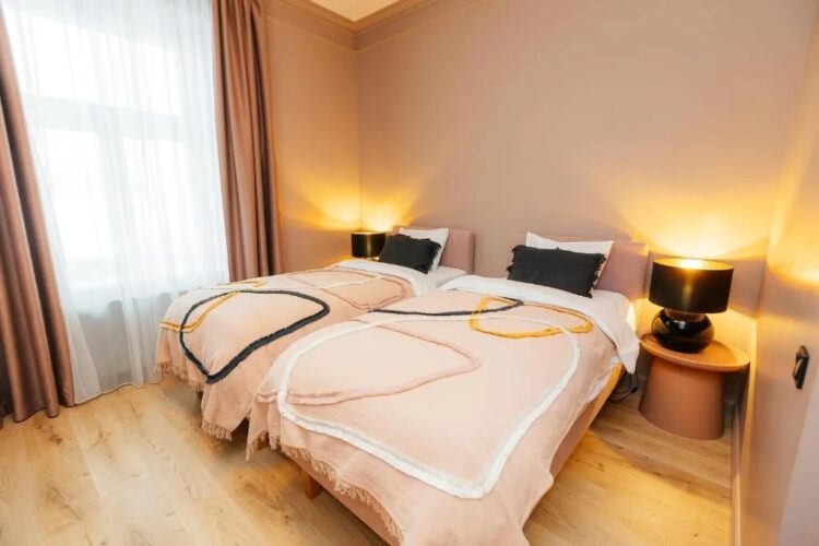 chambre avec lits jumeaux dans un studio de la résidence