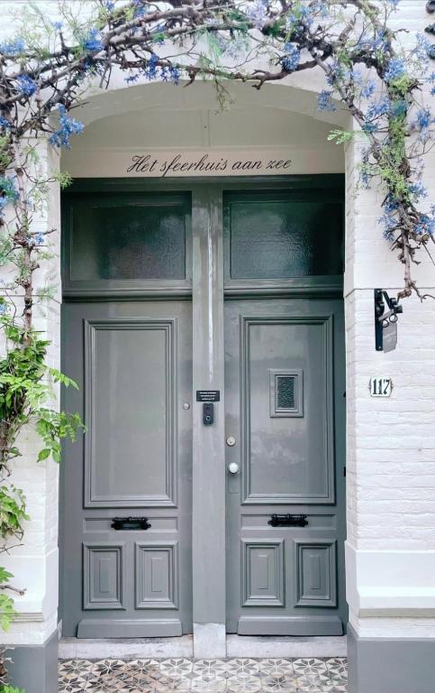 façade d'entrée de la location vacances Het Sfeerhuis aan zee